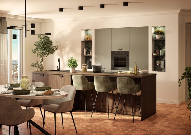 Cuisine îlot vert sauge et bois foncé Cuisine moderne vert sauge et bois sombre, grand îlot central avec espace bar, niches décoratives éclairées